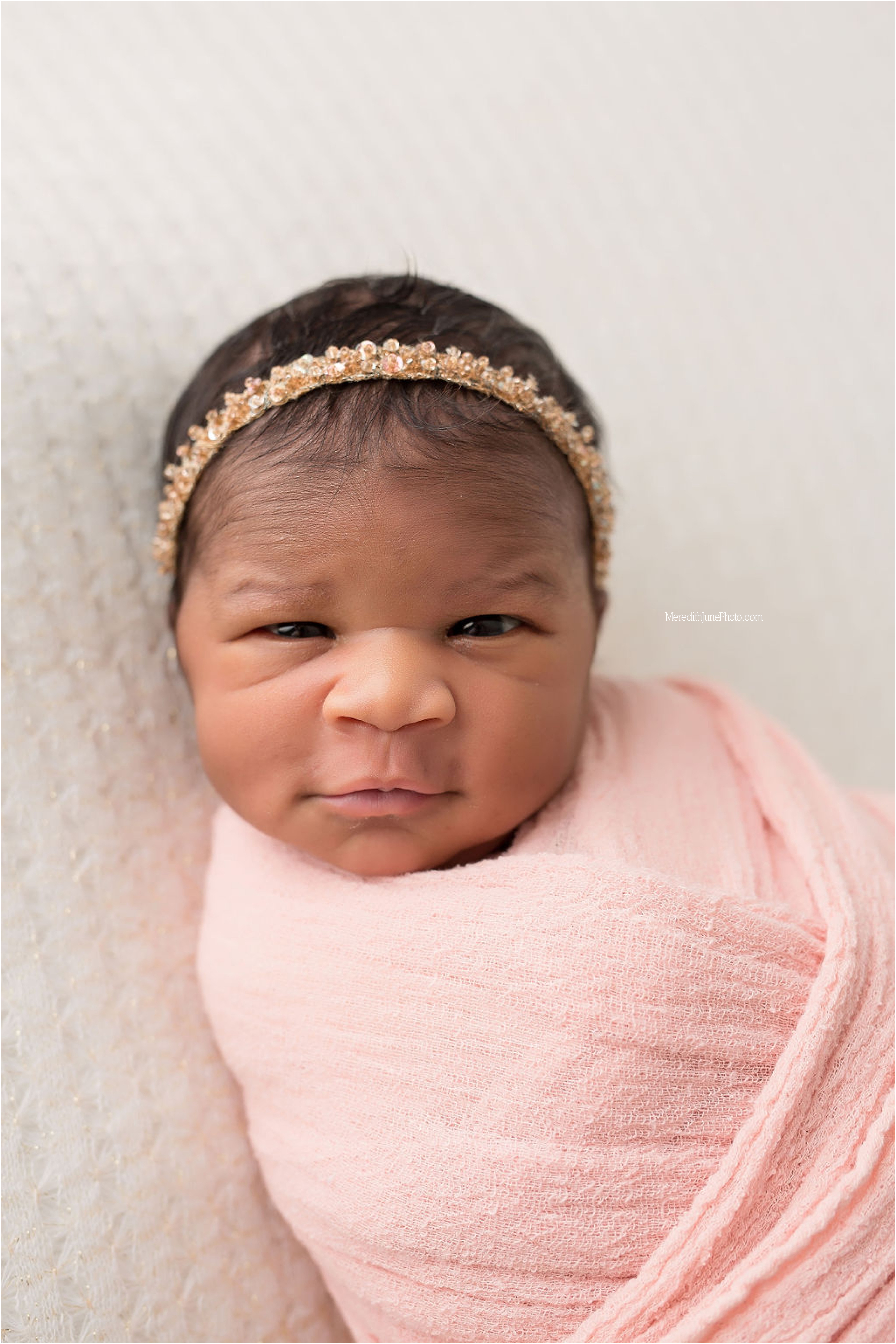 Newborn Eva with eyes wide open