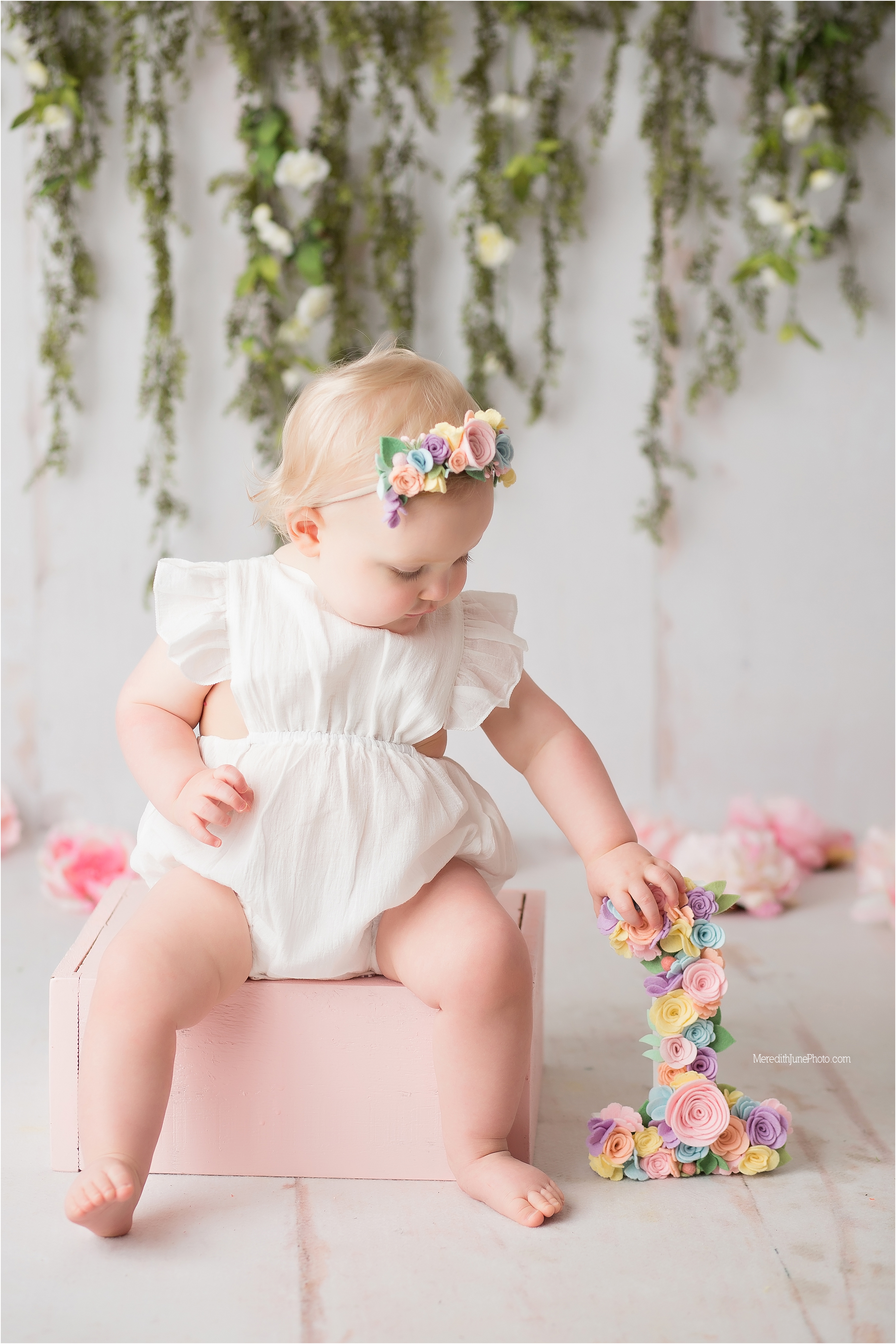 Adorable pastel and greenery cake smash for baby girl 