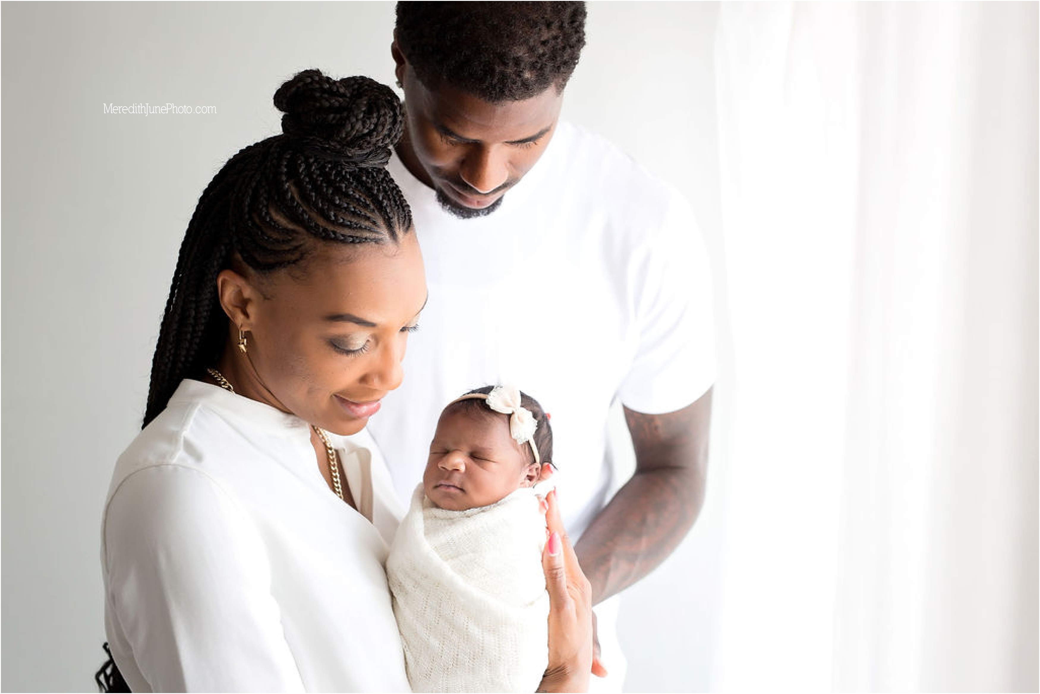 Newborn baby girl with her parents at Meredith June Photography