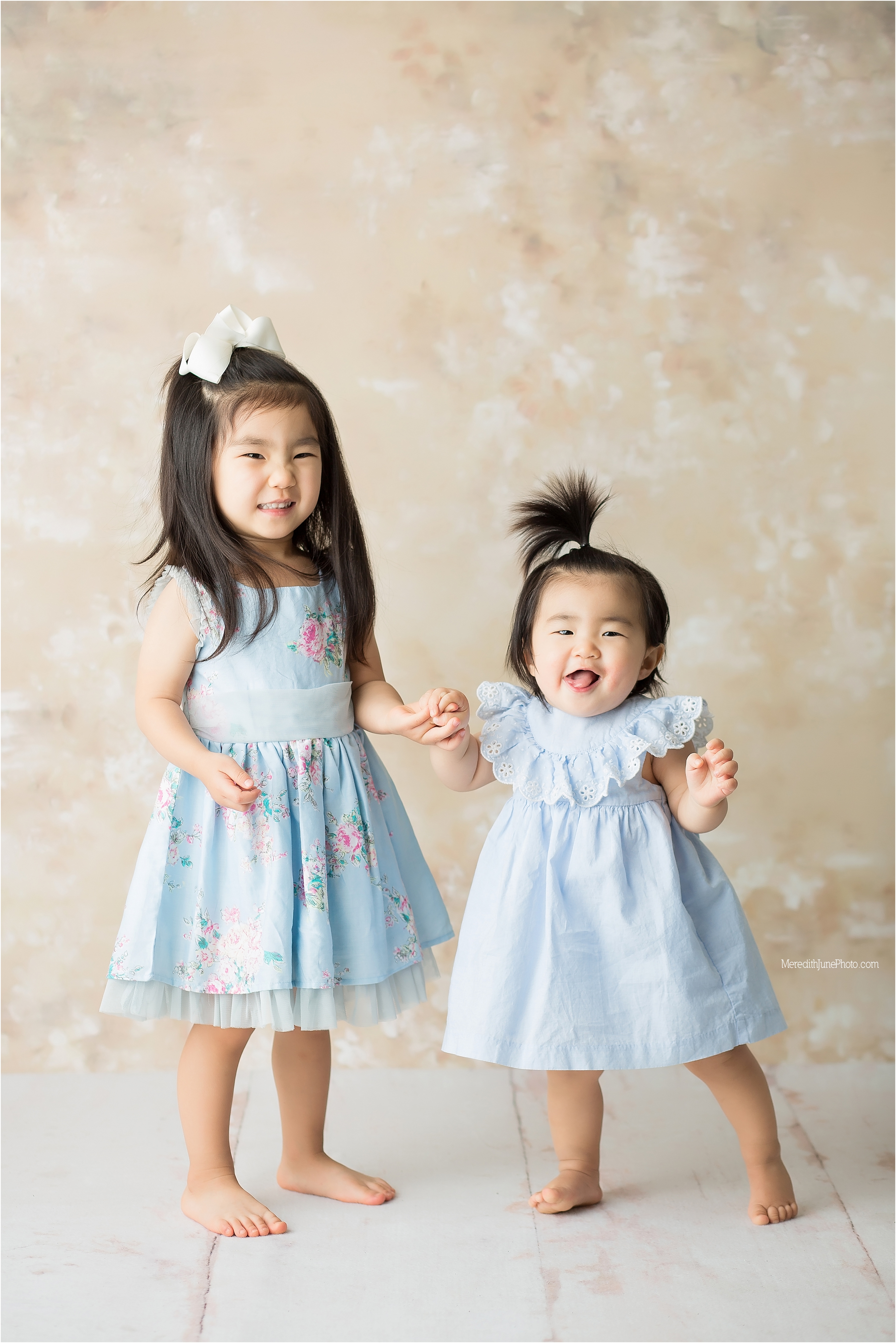 Adorable sisters during cake smash session