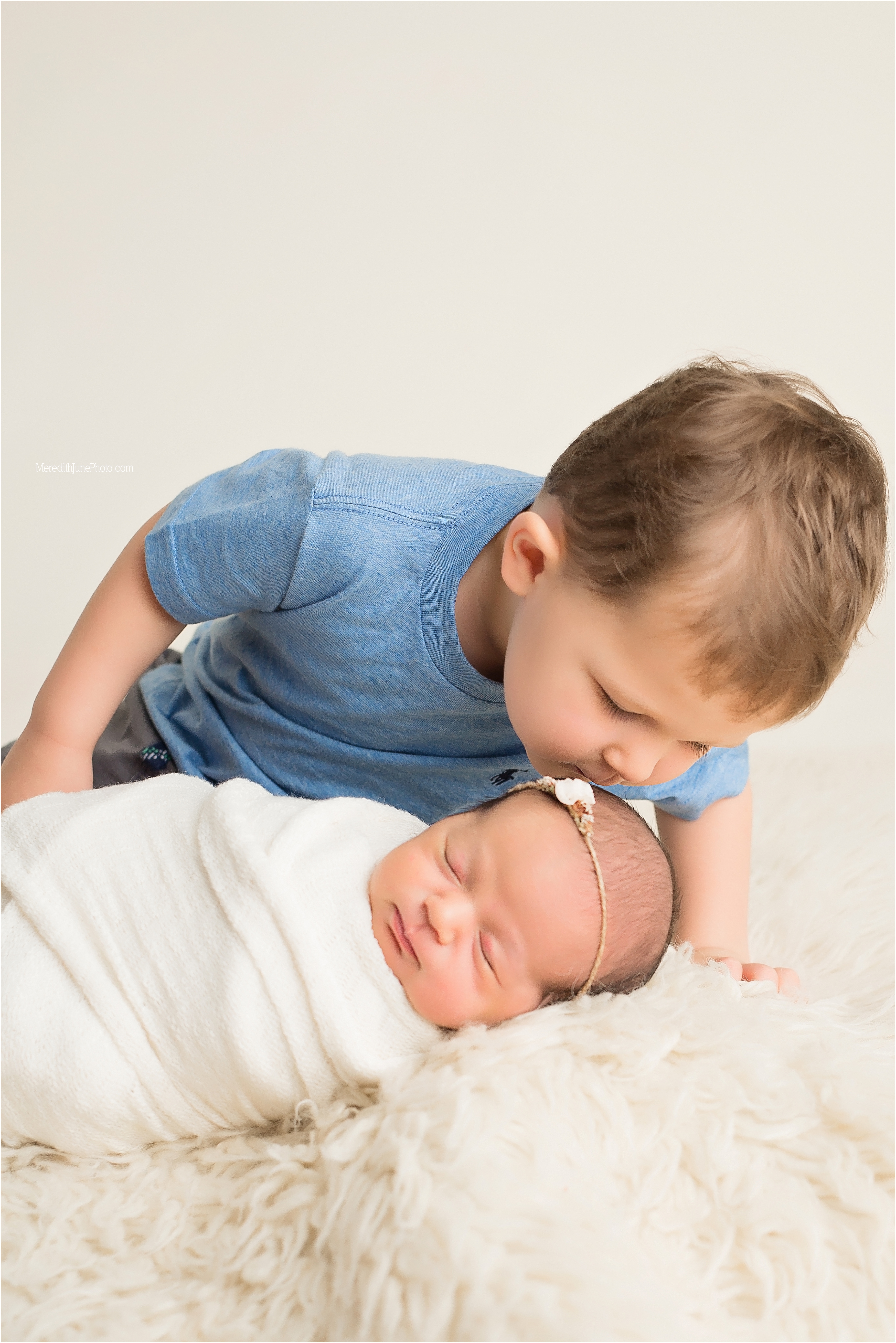 Sibling shots during newborn session for baby girl 
