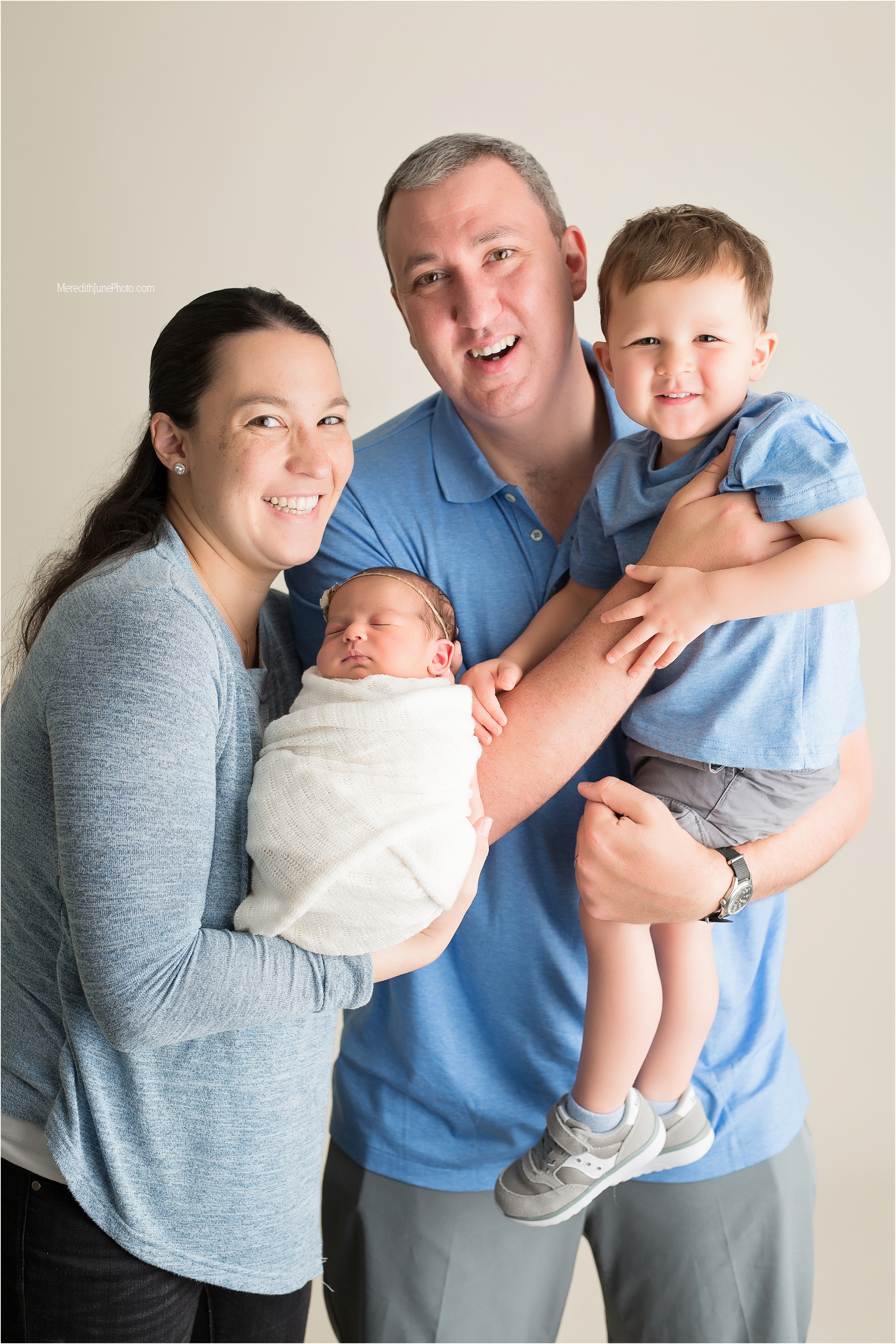 Baby Danielle with family during newborn session