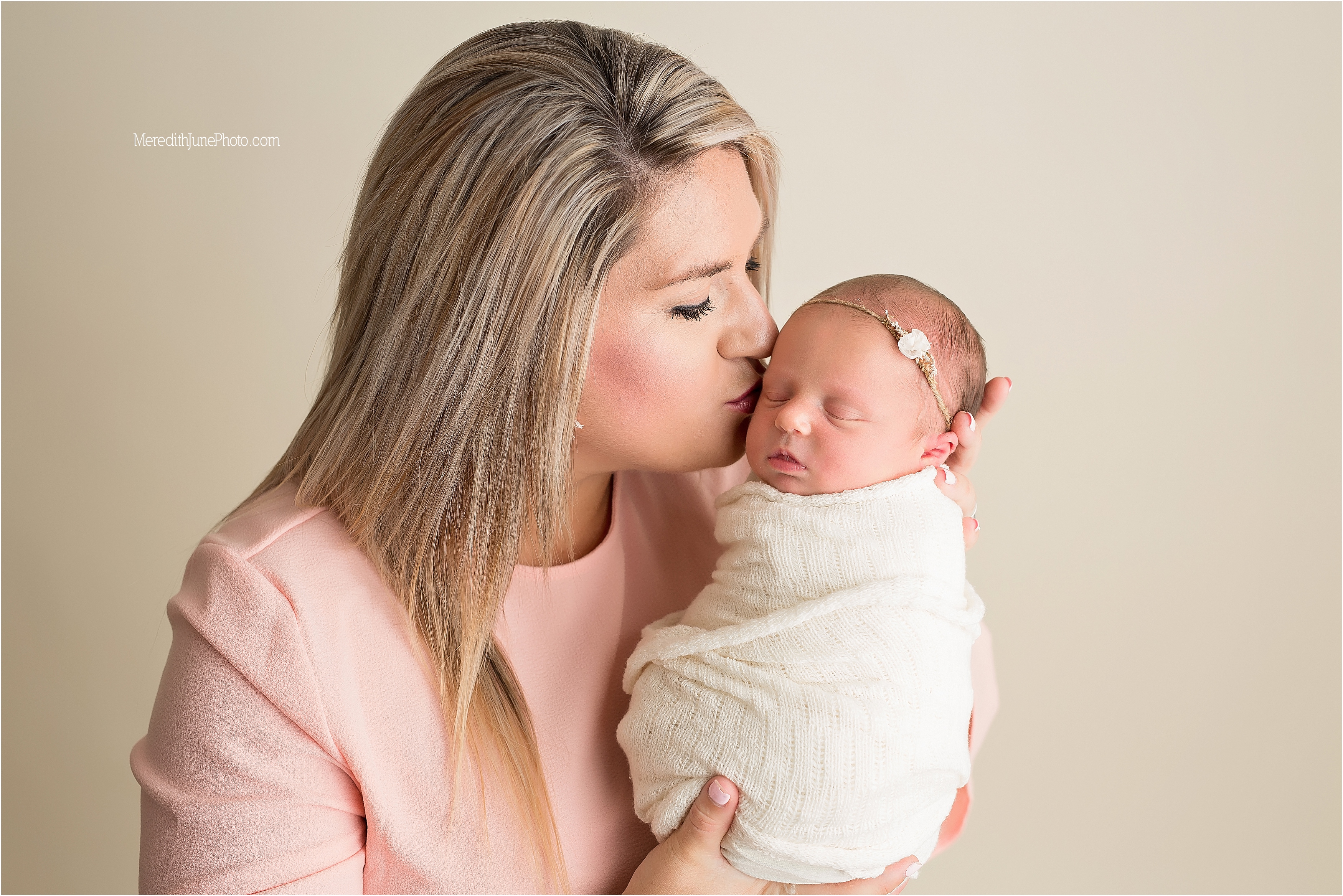 Mom with baby girl Adayln during newborn photo session