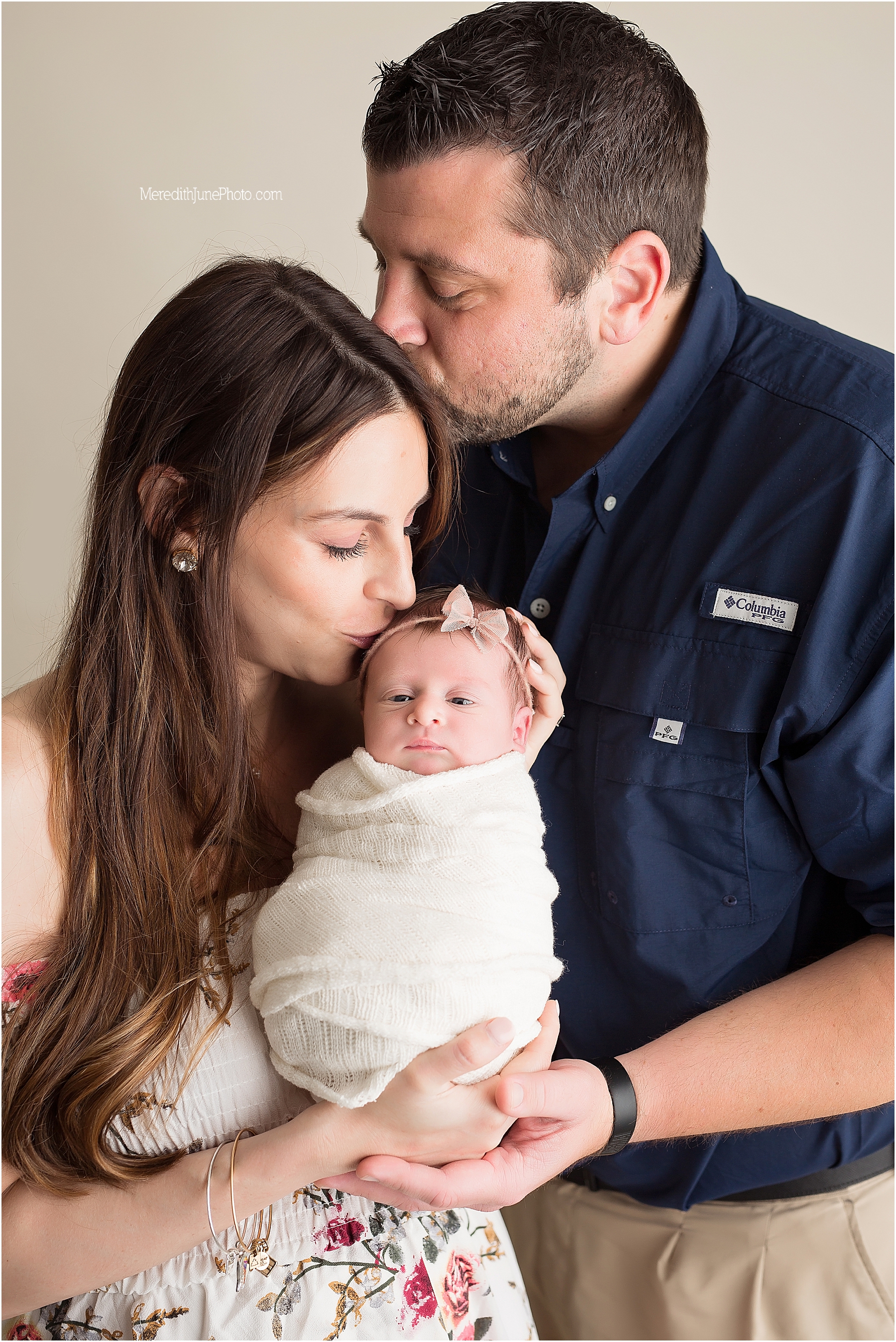 Baby girl Harper with family during newborn mini session