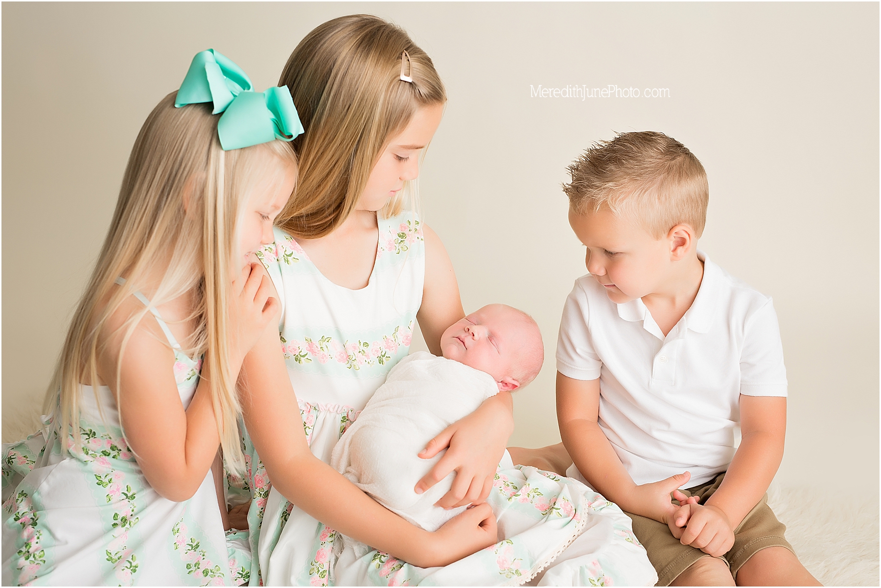 siblings with newborn baby Miller