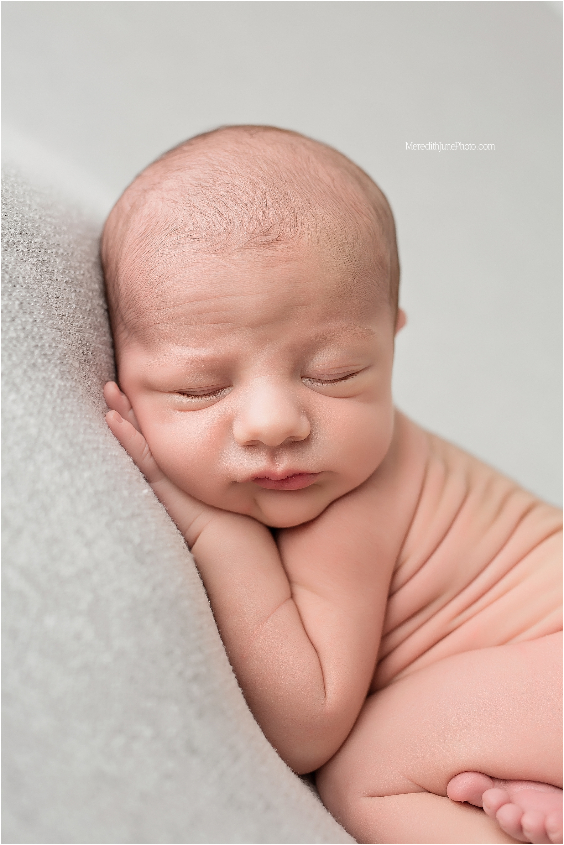 newborn posing for baby boy