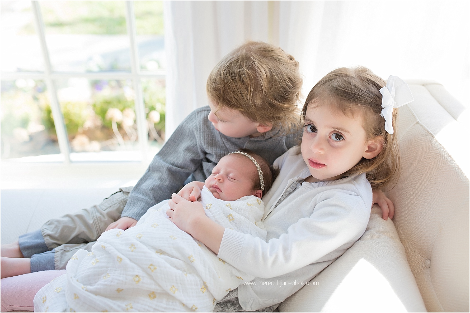 newborn baby with siblings