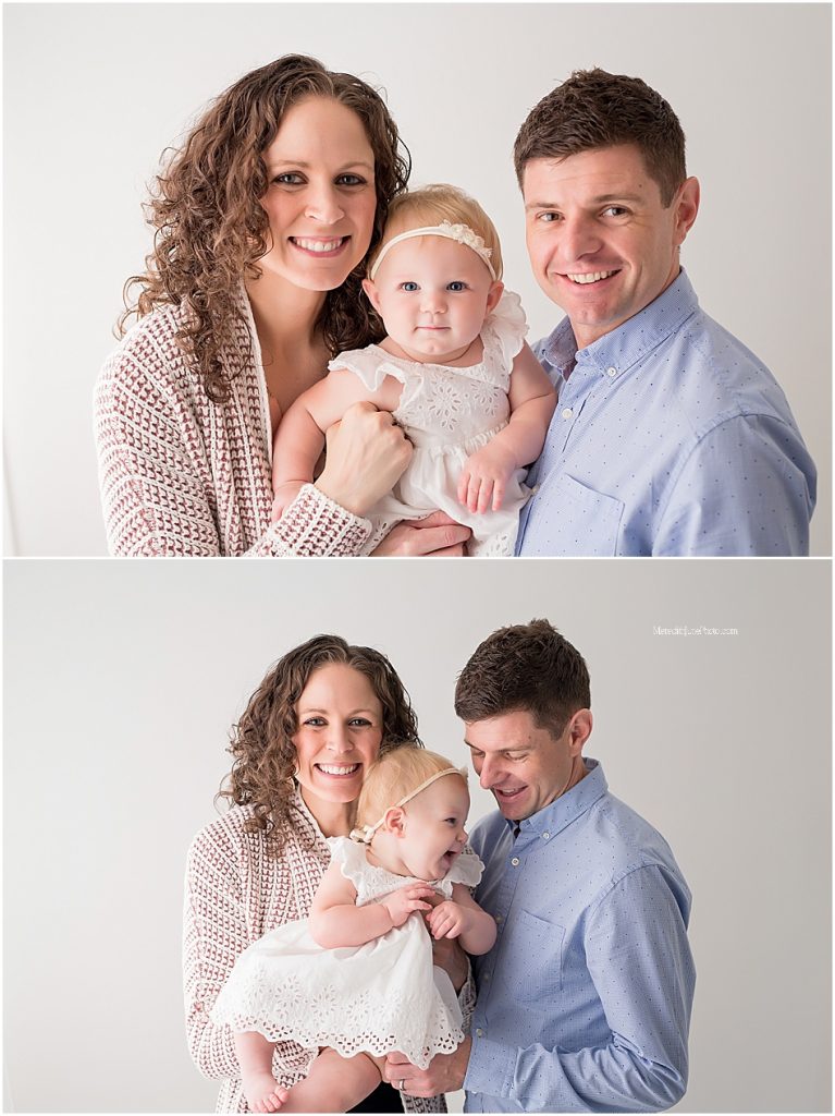baby girl with family photos 