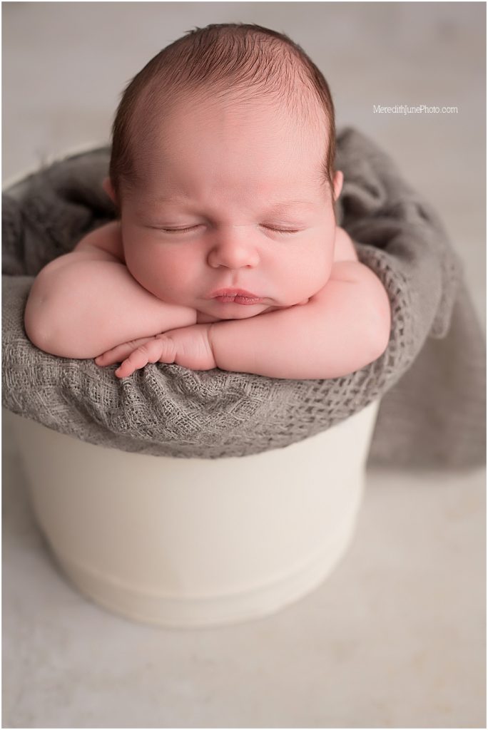 Newborn photo session for baby boy with props 