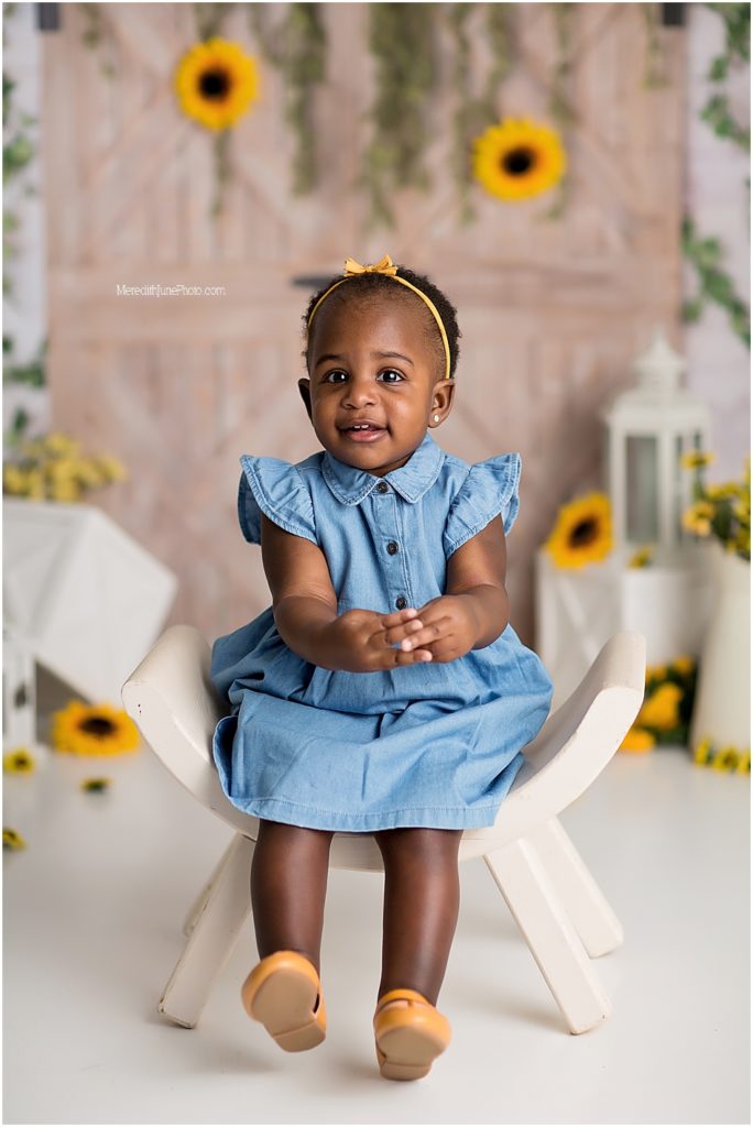 sunflower cake smash set up for baby girl by Meredith June Photography in Charlotte NC 