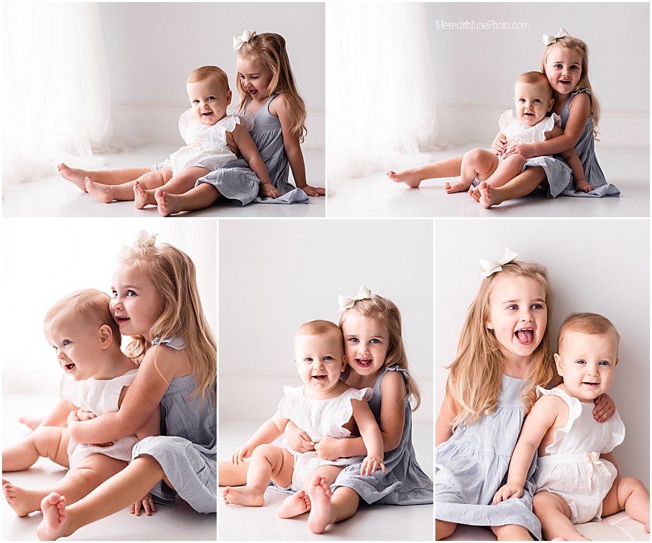 sibling photos during first birthday session at meredith june photography in charlotte area